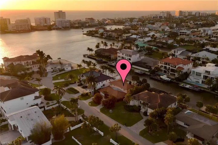 Aerial view featuring a water view, a residential view, and a city view