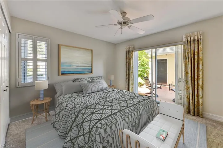 View of Second Bedroom with Access to Courtyard. Virtually Staged.