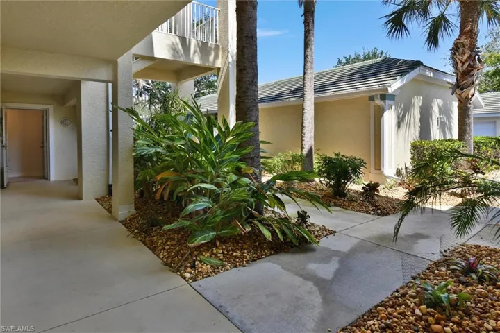 Walkway Leading to Open Front door of Unit 105