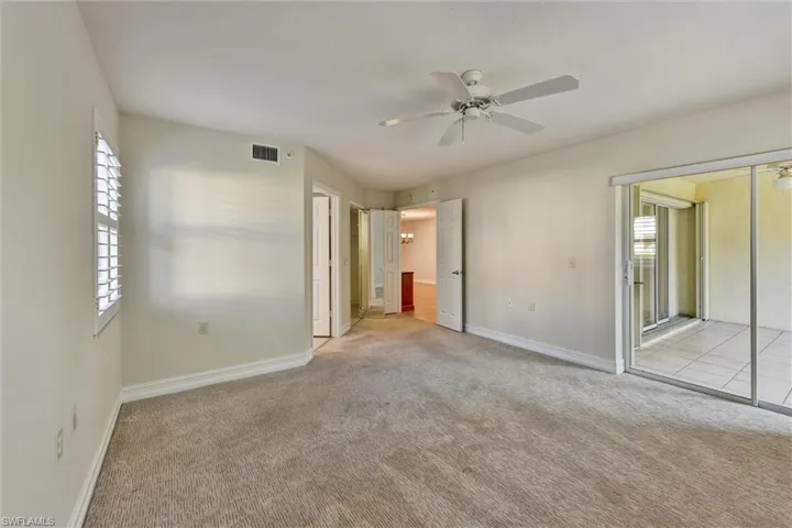View of Master Bedroom into Lanai (Sunroom) and Greatroom