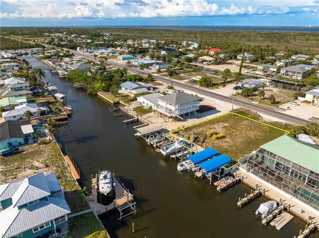 Aerial perspective of suburban area with a nearby body of water