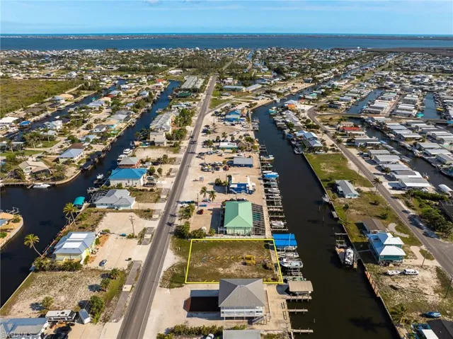Aerial view of commercial area with a nearby body of water