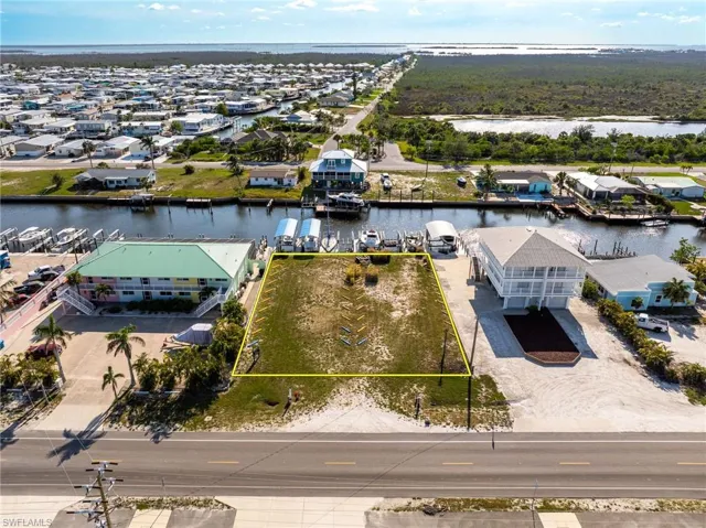 Aerial view of commercial area with a large body of water