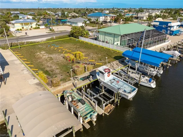 Aerial view of commercial area with a nearby body of water