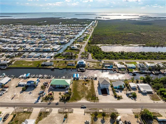 Aerial view of property's location featuring a nearby body of water