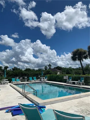 Community pool featuring a patio