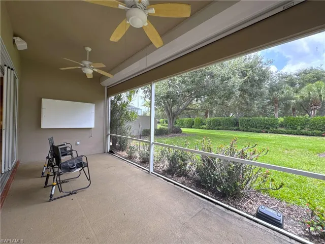 Beautifully landscaped backyard offering a private and serene outdoor setting with lush tropical surroundings and plenty of space to enjoy the Naples lifestyle.
