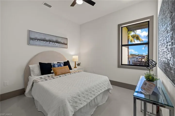 Bedroom featuring concrete floors and ceiling fan