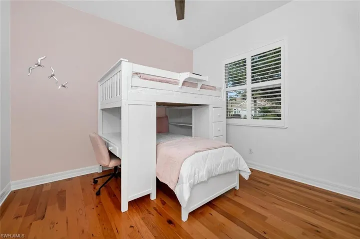 Bedroom 3 featuring hardwood  flooring and ceiling fan