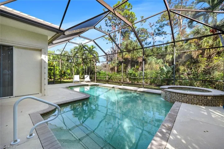View of heated salt water pool and spa