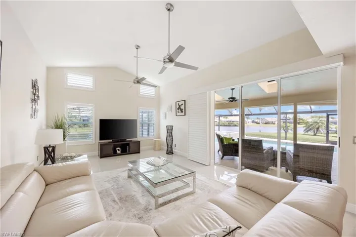 Living room with lofted ceiling and baseboards