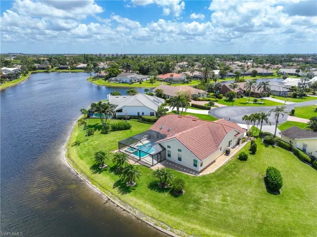 Aerial perspective of residential area with a nearby body of water