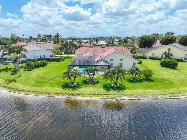Aerial perspective of residential area with a large body of water