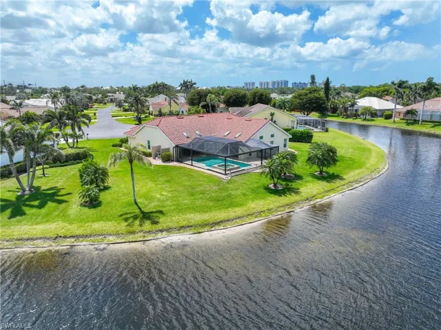 Aerial view of residential area featuring a large body of water