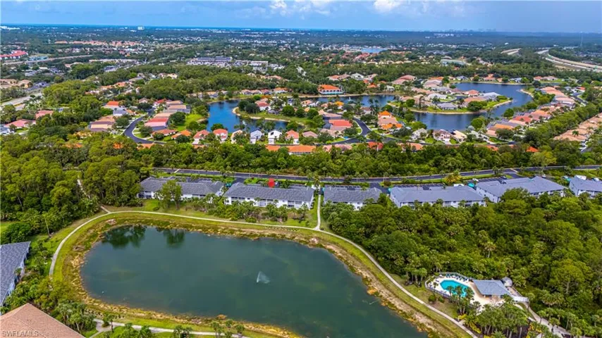 Aerial overview of property's location with a large body of water and nearby suburban area