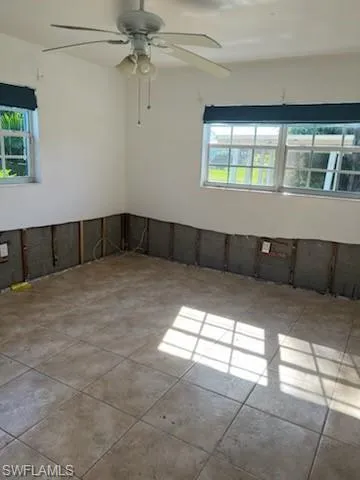 Spare room with ceiling fan