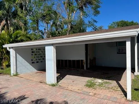 View of vehicle parking with a carport