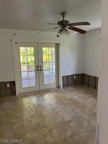 Doorway to outside with ceiling fan and french doors