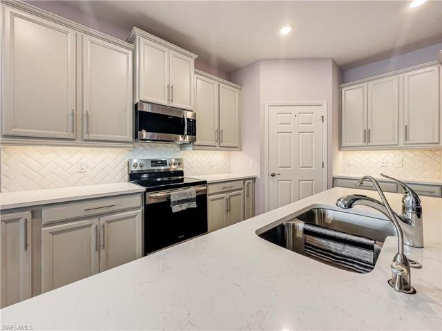 Quartz kitchen counters with a custom pantry organizer