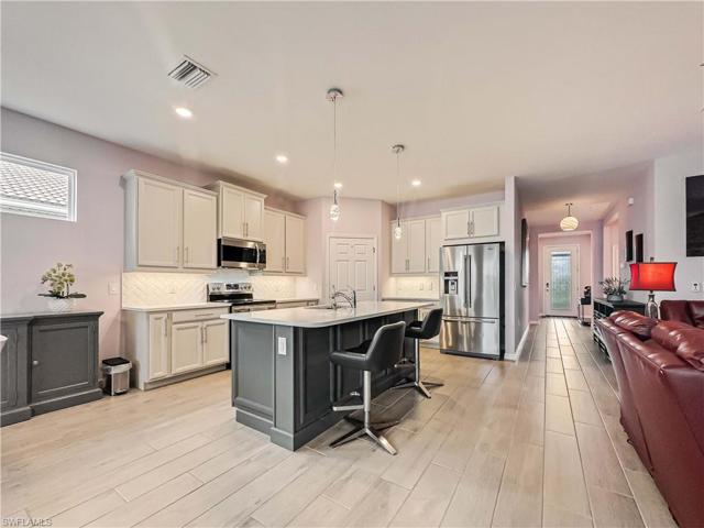 View of Kitchen with darker grey island