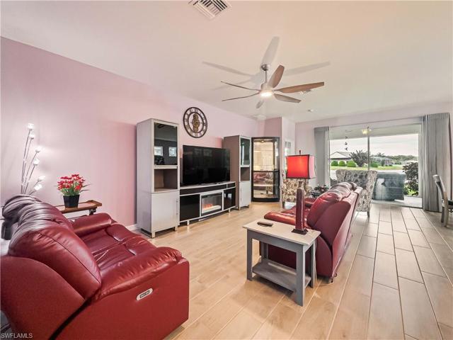 Living Room has an electrical outlet under couch