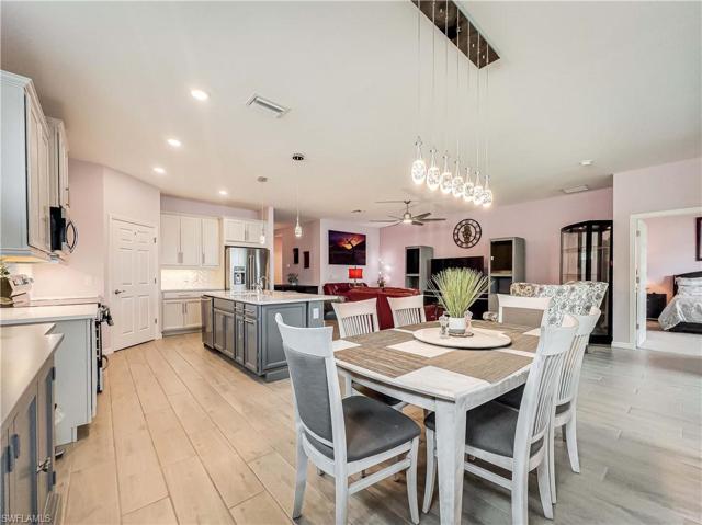Open concept floor plan with view of dining, kitchen and living room