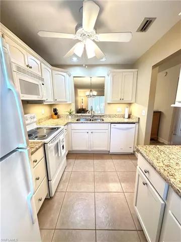 Updated kitchen with granite counters &  ceiling fan