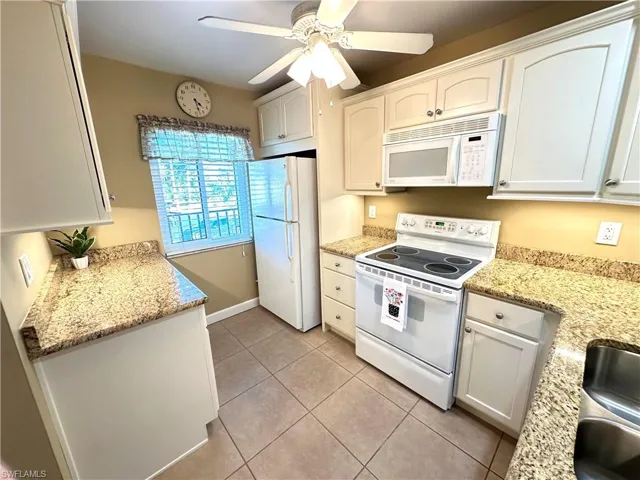 Updated kitchen with granite counters &  ceiling fan
