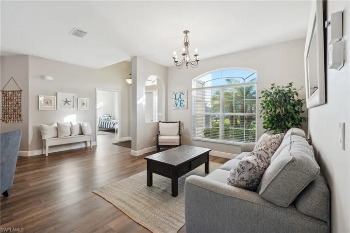 Open Floor plan, use as another sitting area or dining! Nice natural light embraces the newer wood-like flooring.