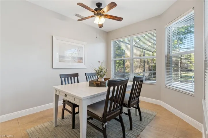Dining space next to Kitchen with lots of natural lighting. Dining table & chairs are nice solid wood!