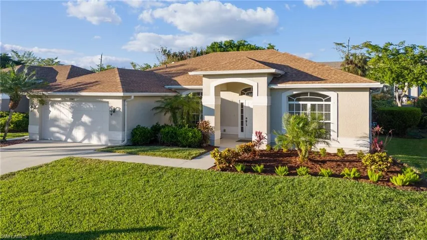 Lush front lawn with New landscaping with fresh mulch.