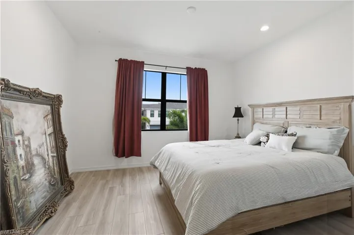 Bedroom featuring light wood-type flooring and recessed lighting