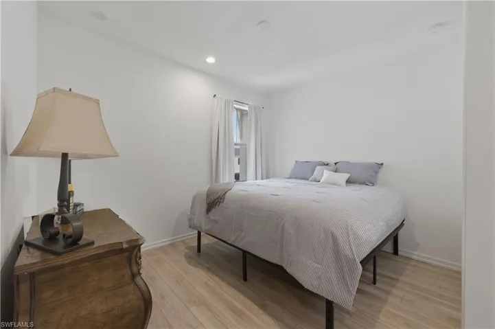 Bedroom featuring light wood-type flooring and recessed lighting