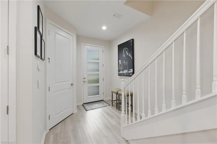Entrance foyer featuring light wood-style flooring and recessed lighting