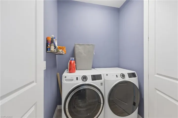 Laundry area featuring washing machine and clothes dryer