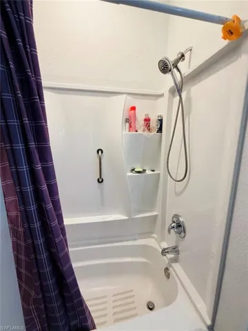 Full bath featuring shower / bathtub combination with curtain