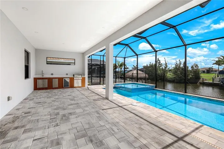 huge screened lanai with outdoor kitchen
