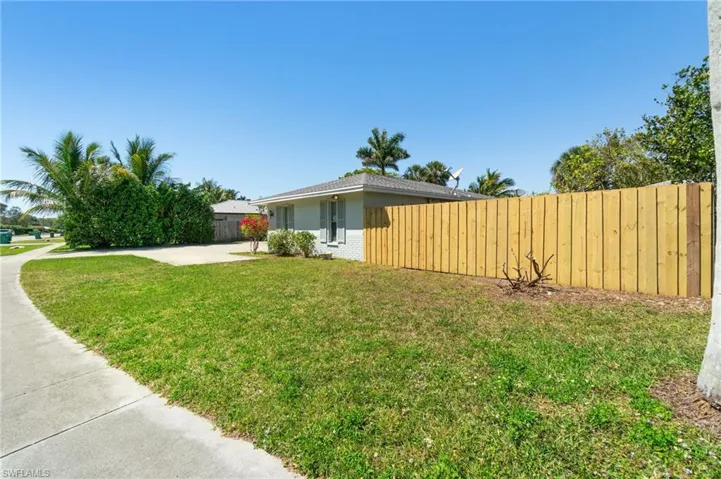 View of yard featuring fence