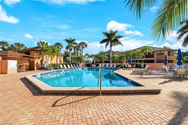 Community pool with a patio area