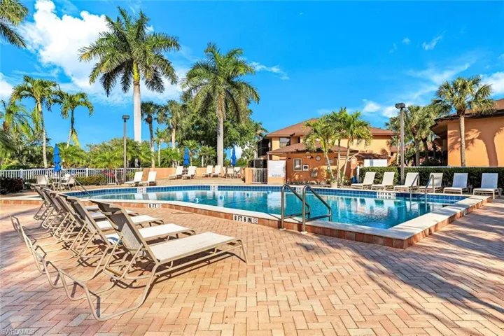 Community pool featuring a patio area