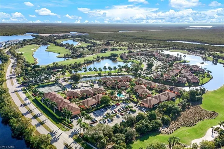 Aerial overview of property's location with a golf course, a nearby body of water, and nearby suburban area