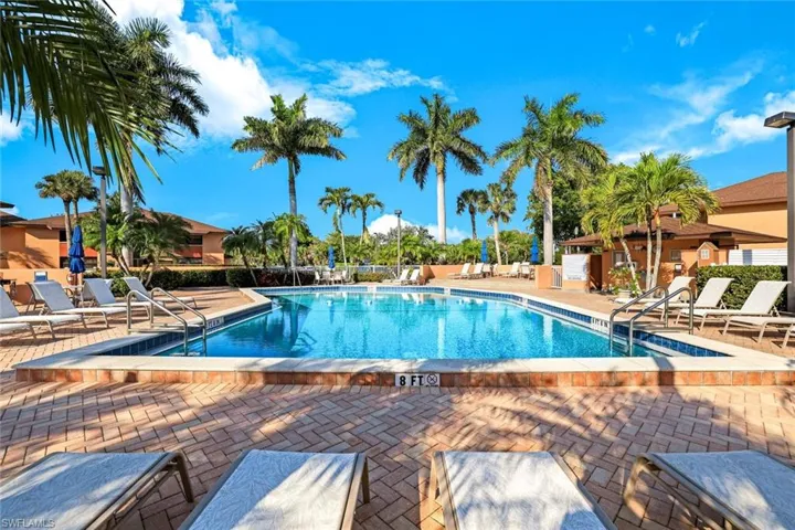 Community pool featuring a patio