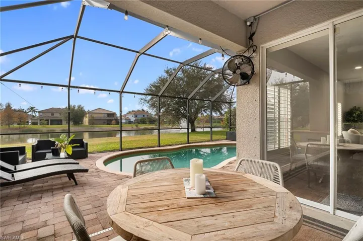 View of patio featuring a sunroom and a lanai