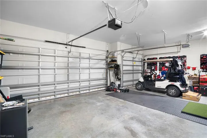 Garage featuring a garage door opener