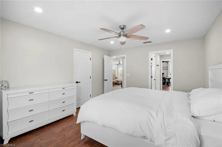 Bedroom featuring recessed lighting, dark wood finished floors, and a ceiling fan