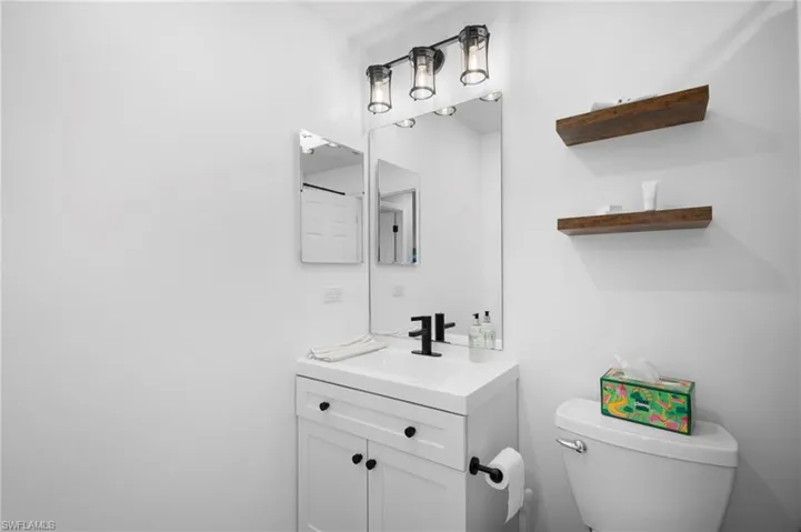 Bathroom featuring vanity and toilet