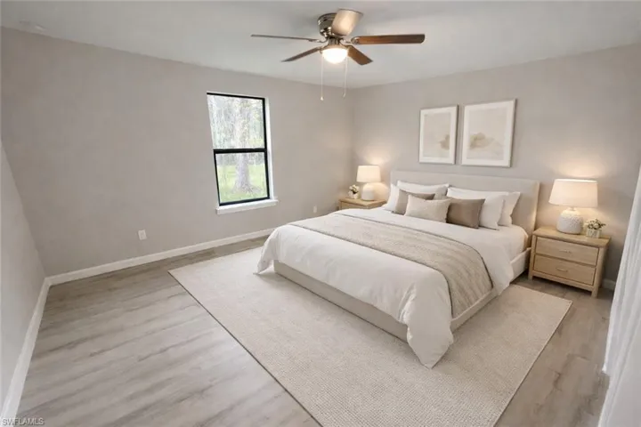Bedroom featuring a ceiling fan and light wood-type flooring