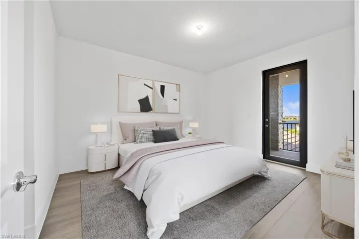 Bedroom featuring access to outside and light wood-type flooring
