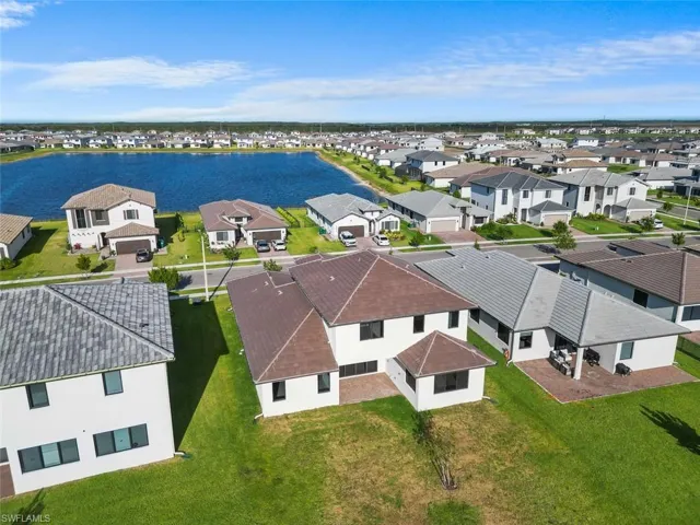 Aerial view featuring a water view and a residential view