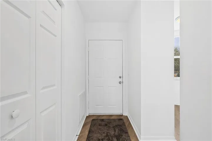 Hallway featuring hardwood / wood-style floors
